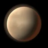 Artist's impression: the envelope-hot look, for radius 1.6 to 4 R⊕, Teq 1,000 K or more: tan haze and a warm rim. A still of the look, not of a particular planet.